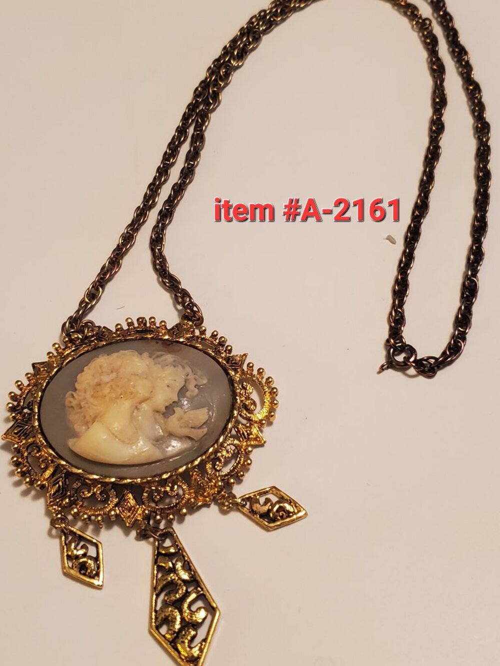 1 Necklace with pendant, item # A 2161, wt.  56 grams.